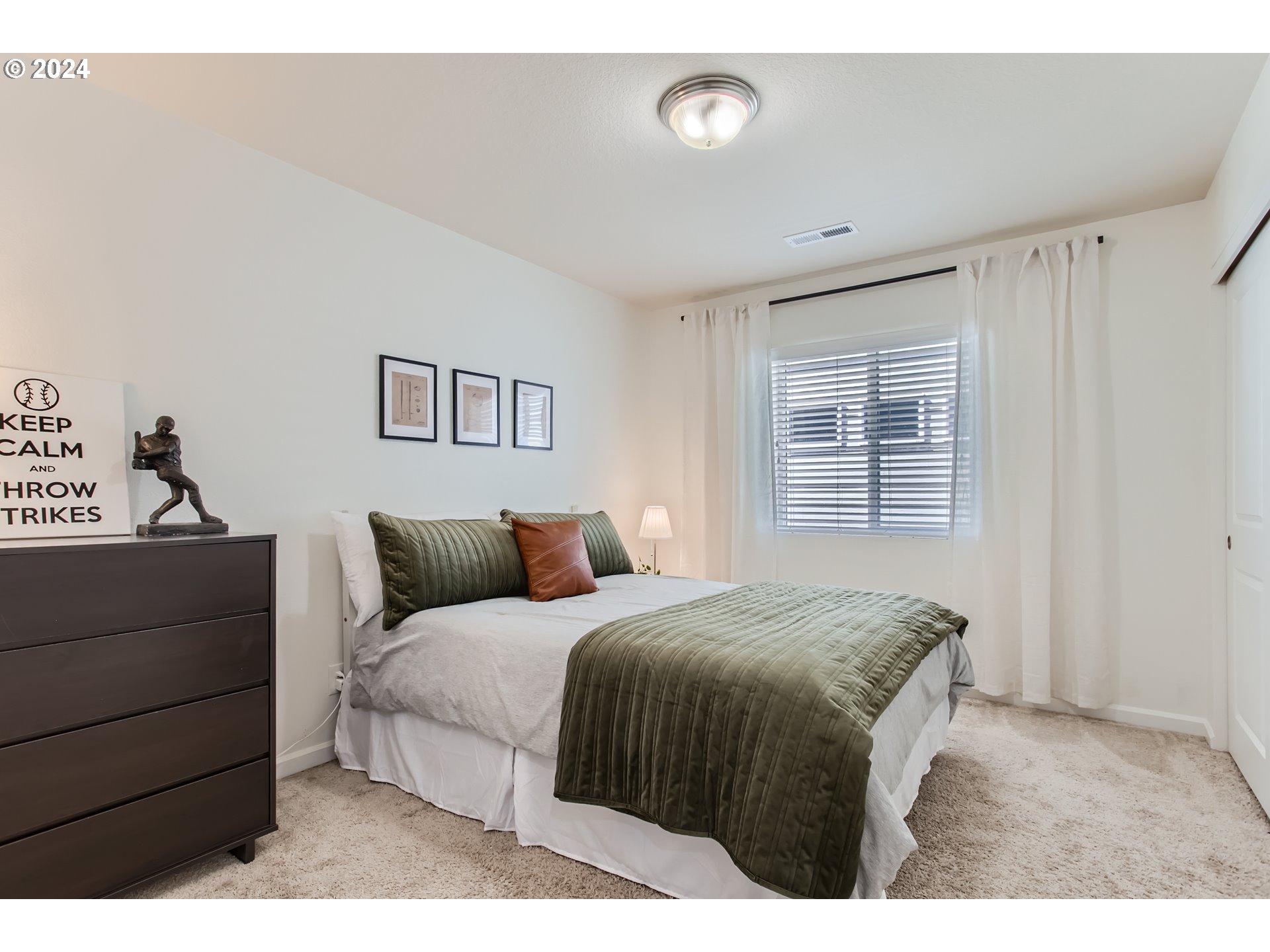 263 North 34th Court Ridgefield, WA 98642 - Photo 22 of 40 a bedroom with a bed and a dresser