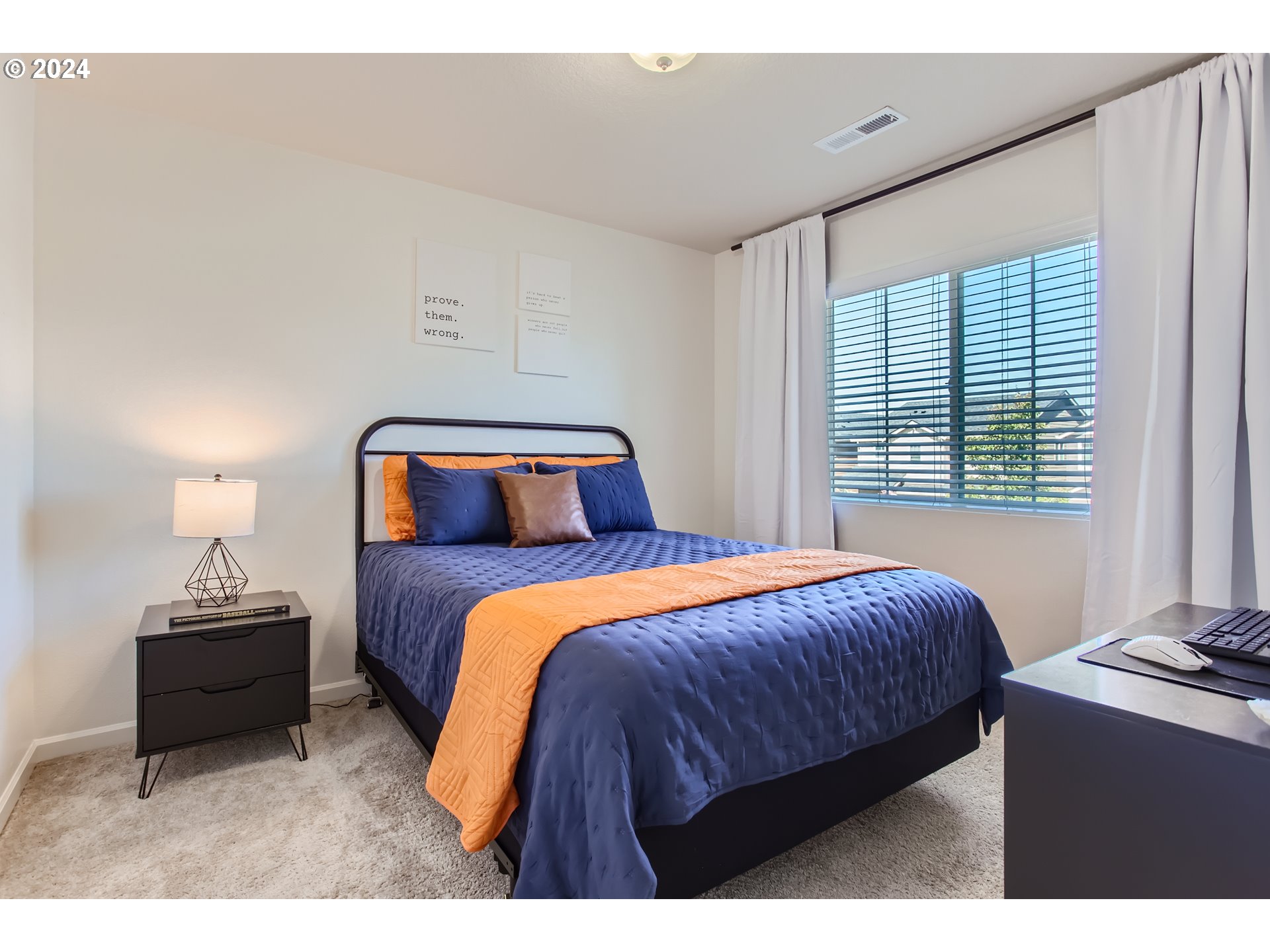 263 North 34th Court Ridgefield, WA 98642 - Photo 24 of 40 a bedroom with a bed and a night stand