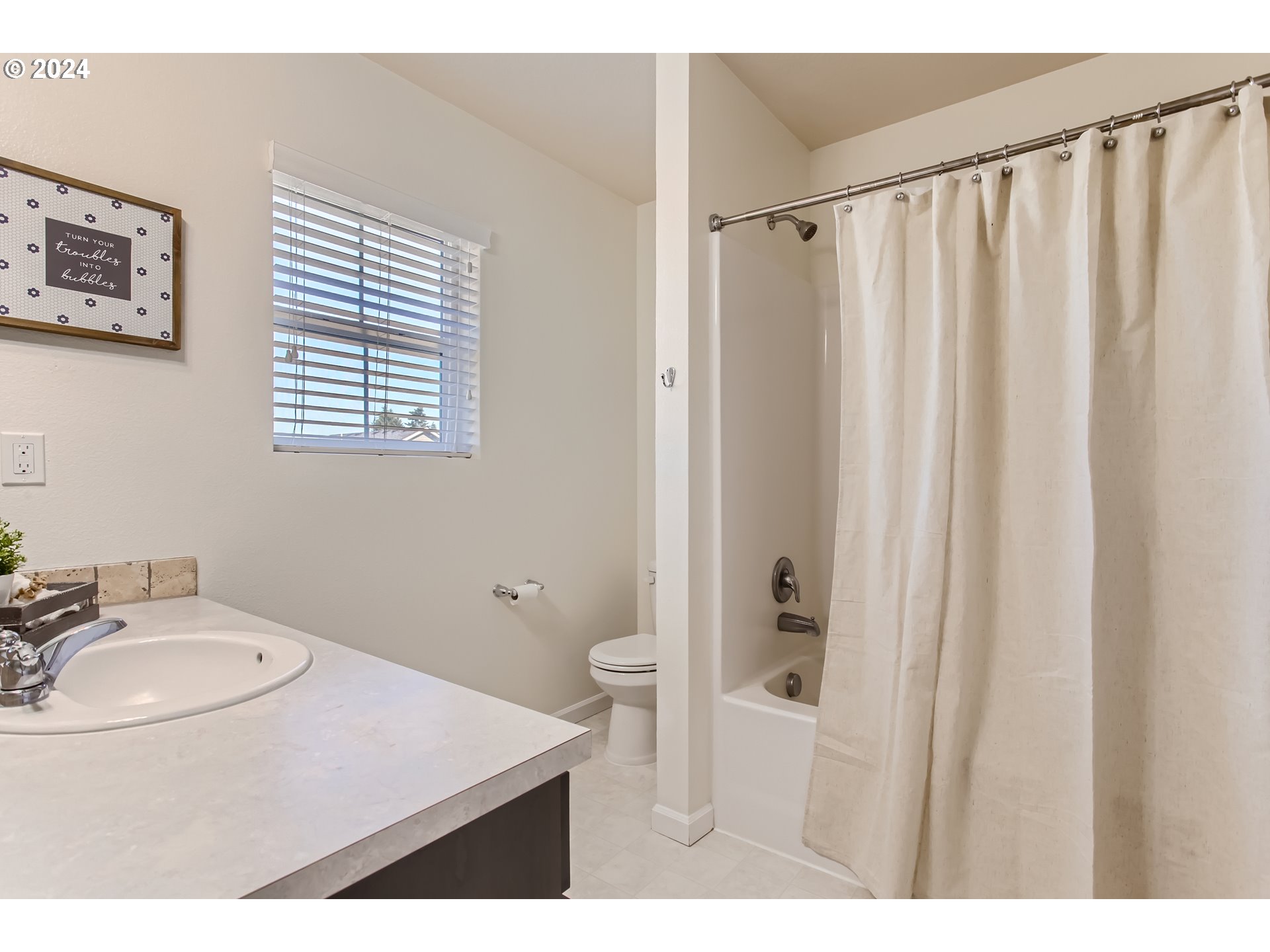 263 North 34th Court Ridgefield, WA 98642 - Photo 26 of 40 a bathroom with a sink toilet and shower