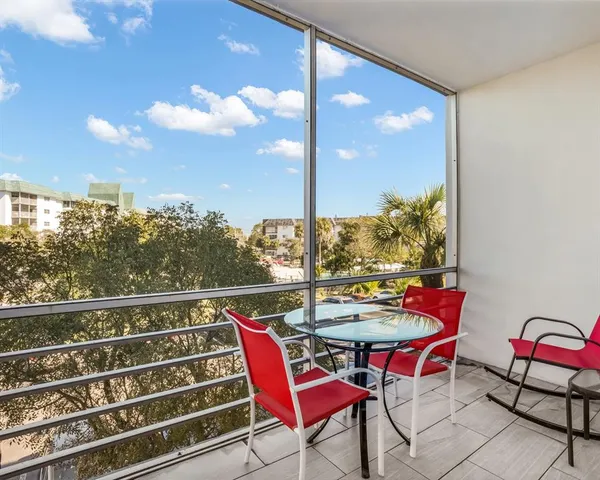 a view of a chairs and table in patio