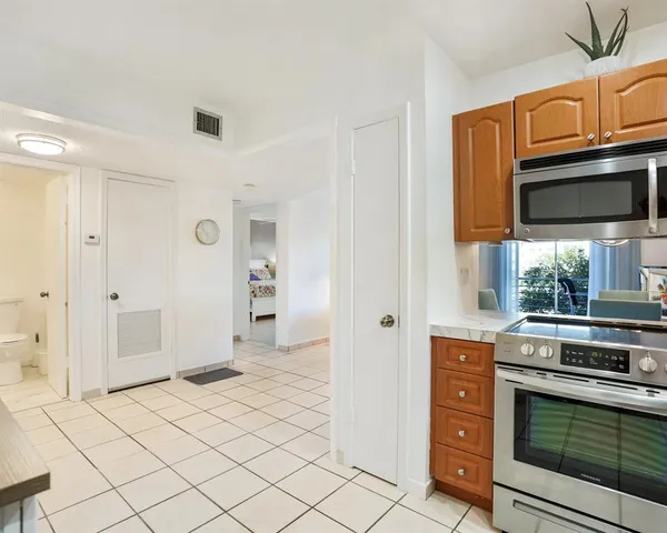 a kitchen with stainless steel appliances a stove and a refrigerator