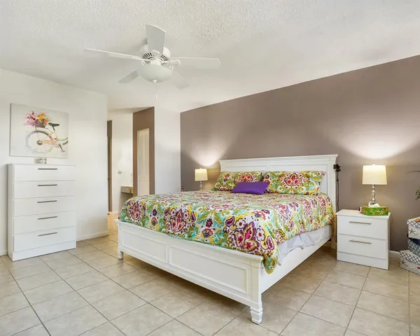 a bedroom with a bed and a cabinets