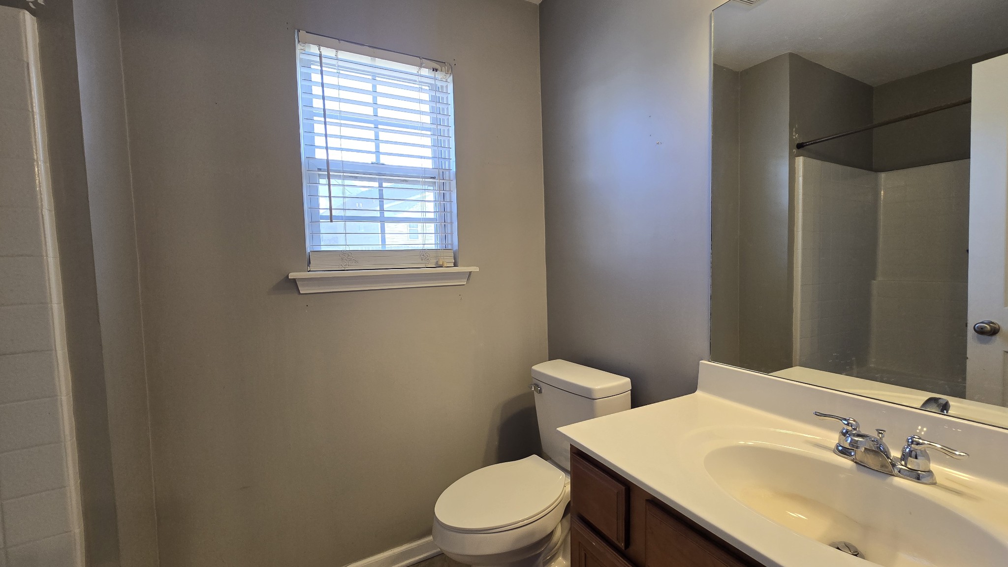 287 Davids Way La Vergne, TN 37086 - Photo 11 of 21 a bathroom with a sink a toilet and shower