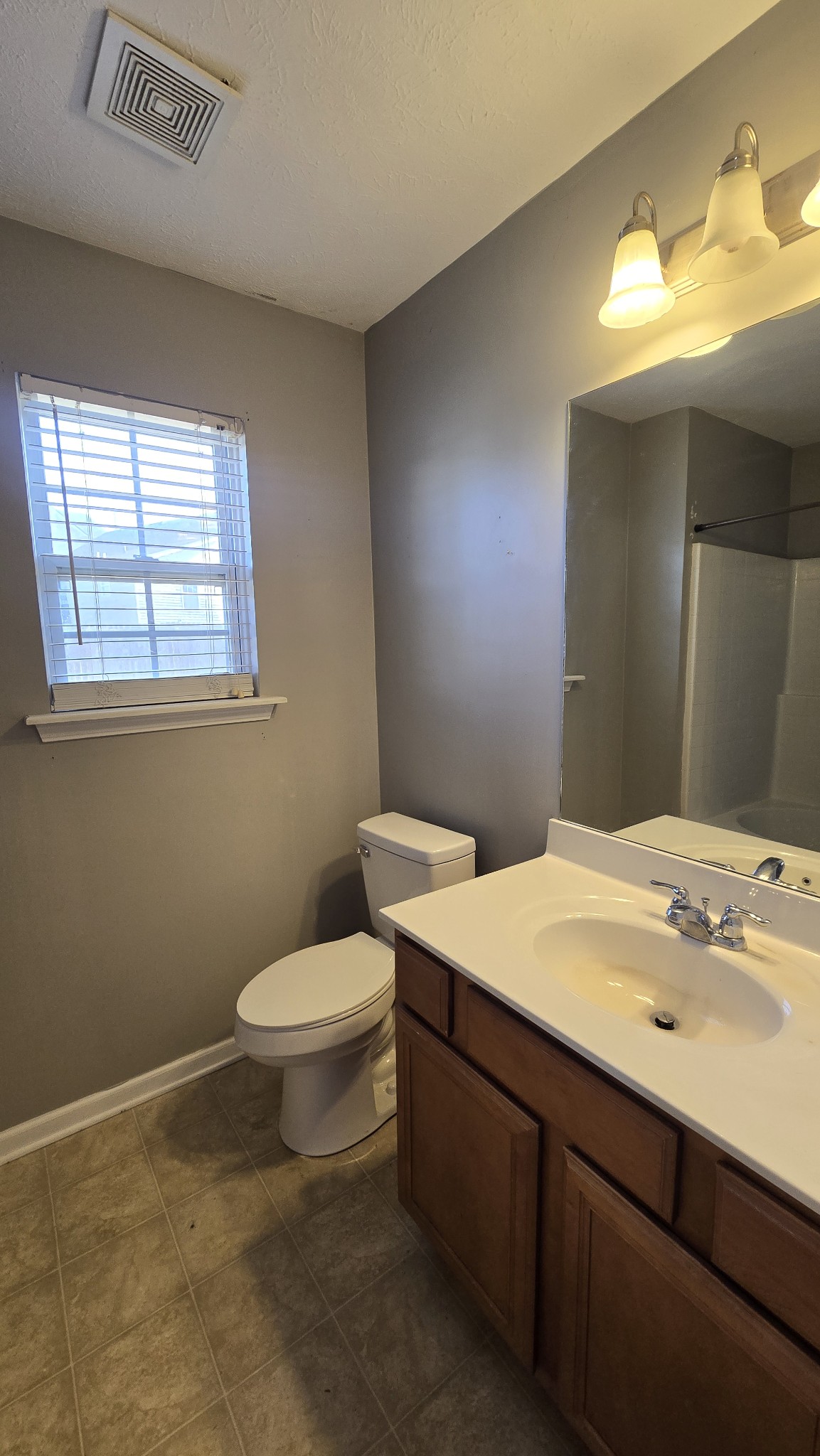 287 Davids Way La Vergne, TN 37086 - Photo 12 of 21 a bathroom with a sink toilet and window
