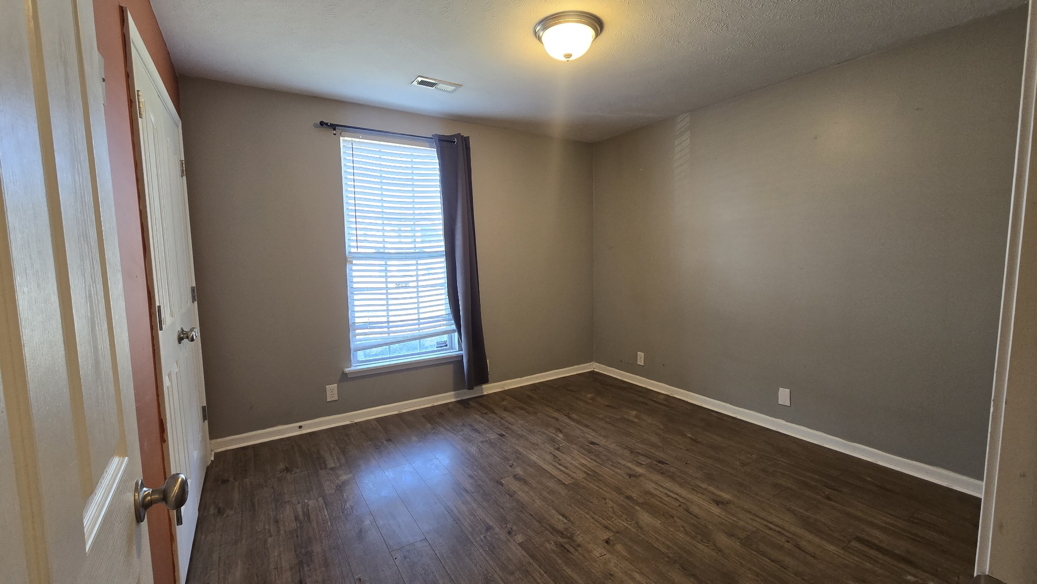 287 Davids Way La Vergne, TN 37086 - Photo 14 of 21 an empty room with wooden floor and windows