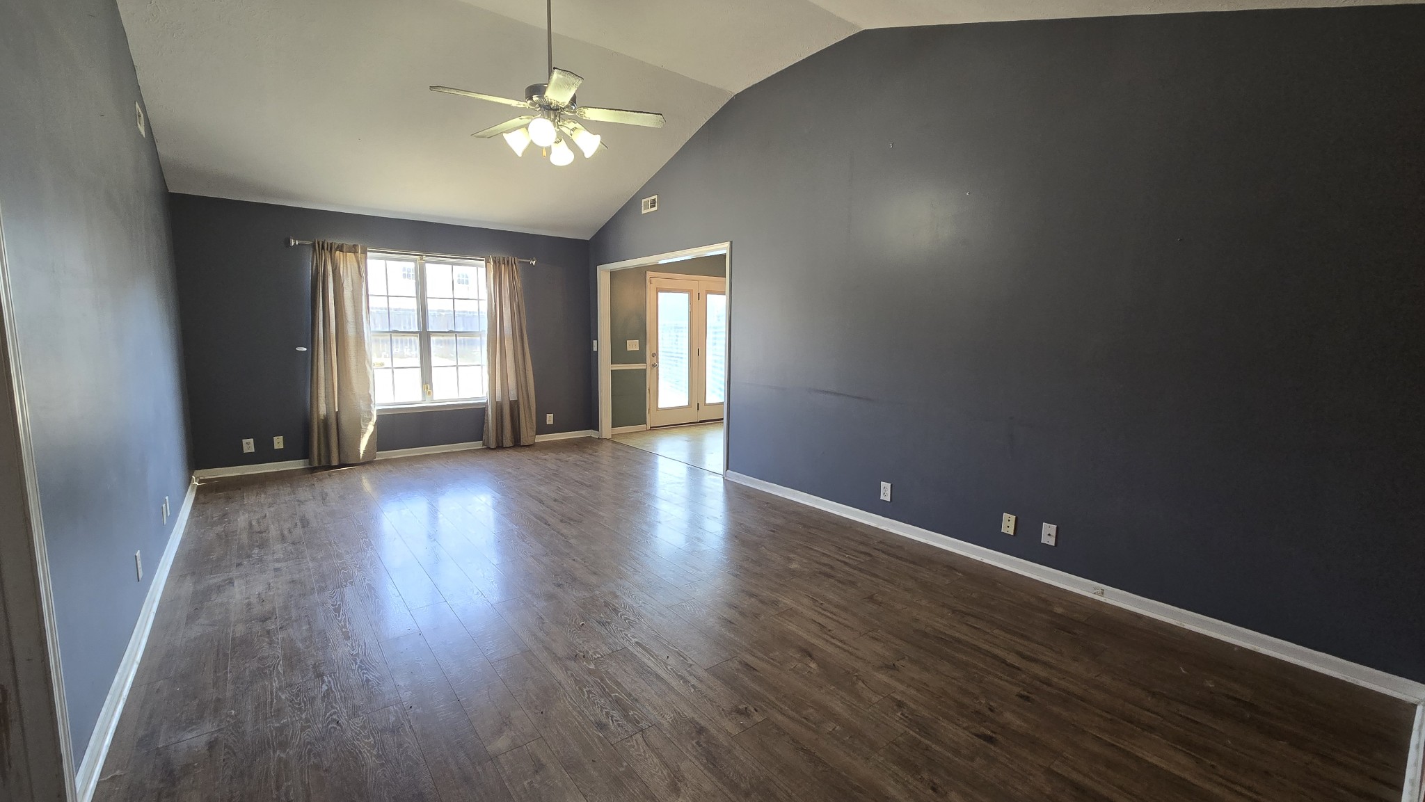 287 Davids Way La Vergne, TN 37086 - Photo 5 of 21 a view of an empty room with window and wooden floor