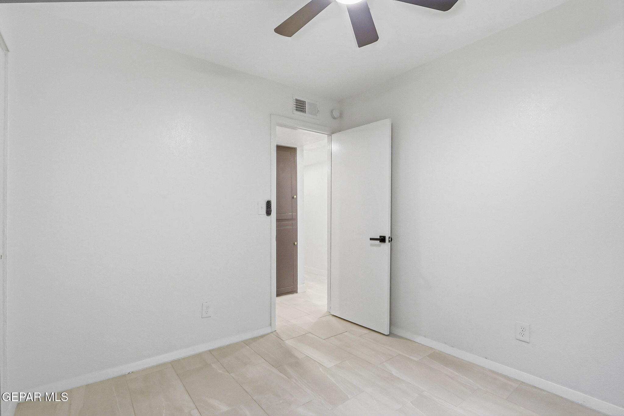 709 Frontera Road El Paso, TX 79922 - Photo 29 of 41 an empty room with chandelier fan
