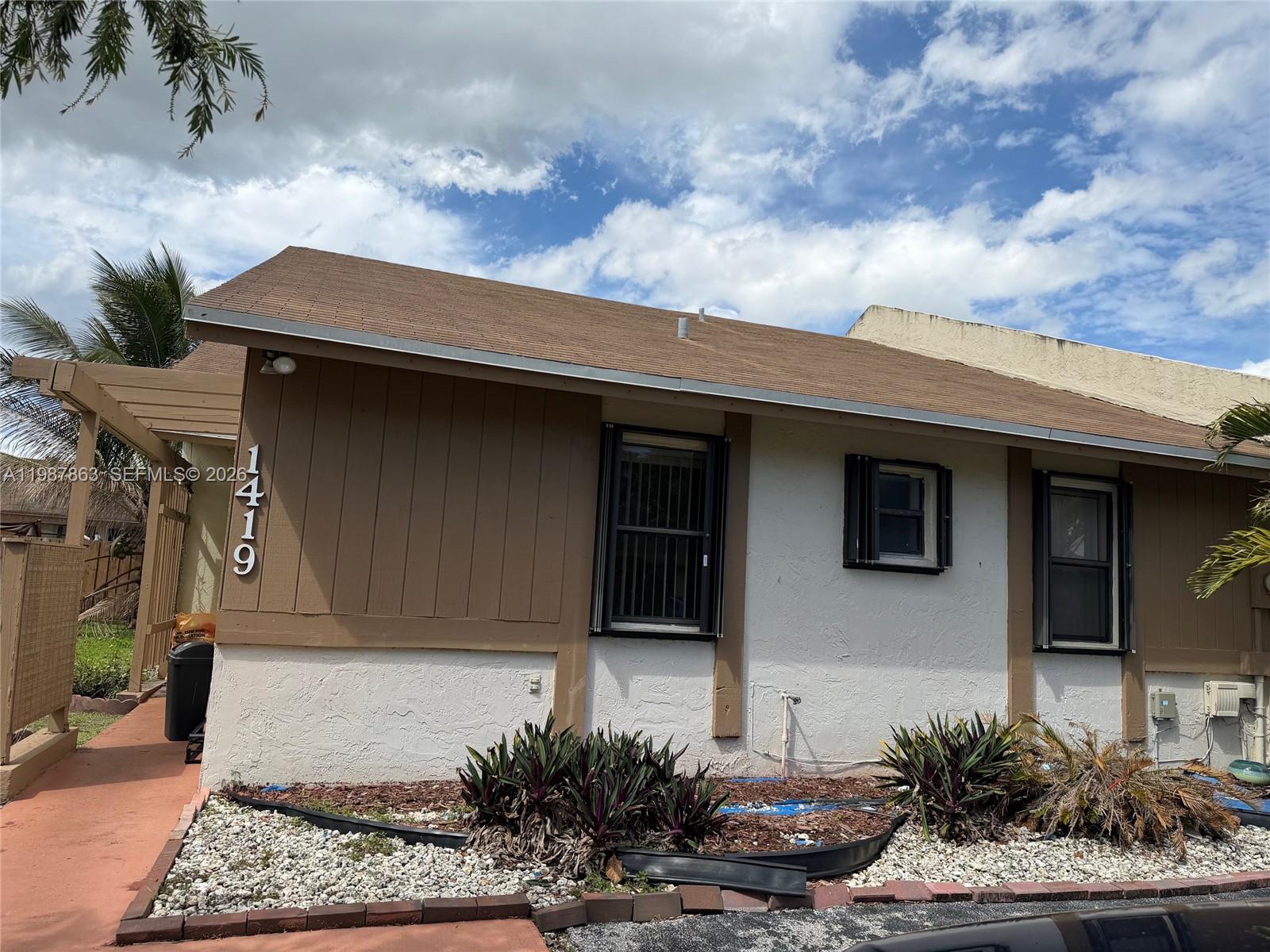 1419 Yellowthroat Street Homestead, FL 33035 - Photo 2 of 26 a front view of a house