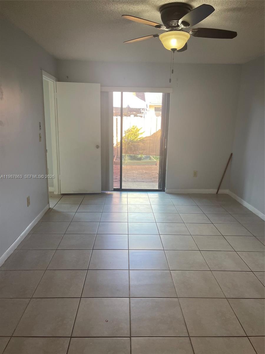 1419 Yellowthroat Street Homestead, FL 33035 - Photo 21 of 26 a view of an empty room with a window