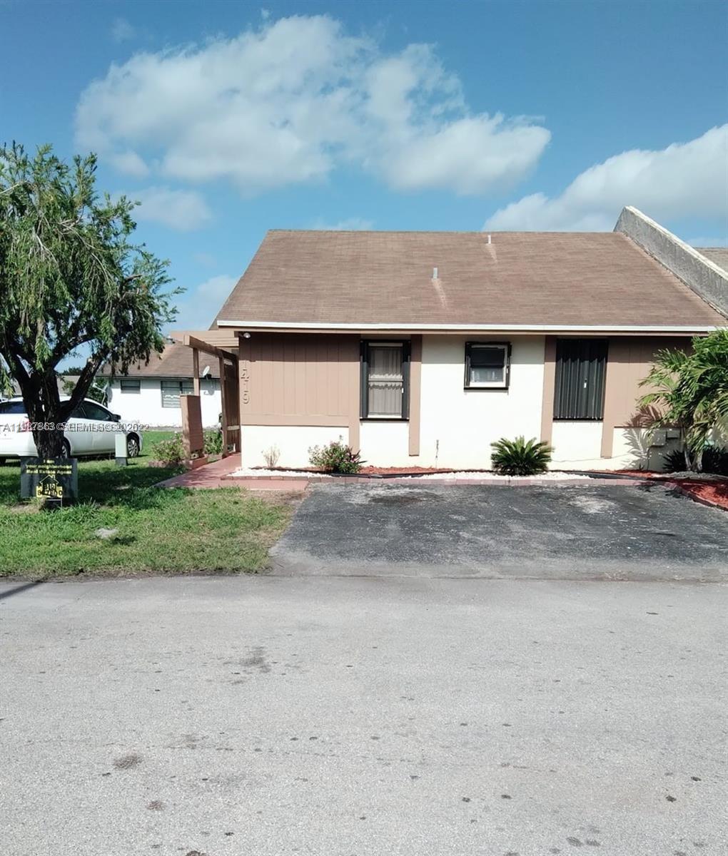 1419 Yellowthroat Street Homestead, FL 33035 - Photo 26 of 26 a front view of a house with a yard