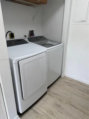 a utility room with dryer and washer