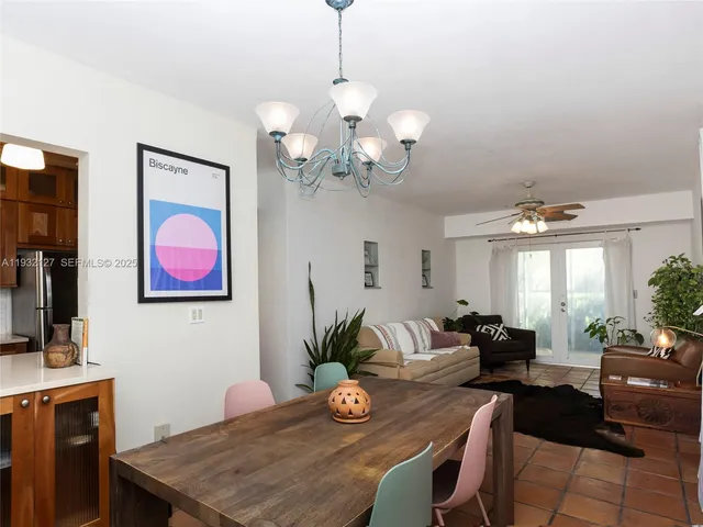 a view of a dining room with furniture wooden floor and chandelier