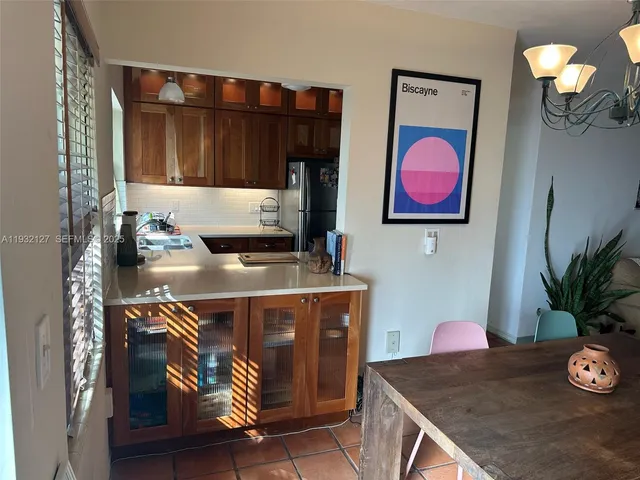 a table with chairs and a stove