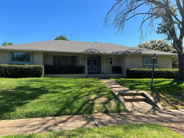a view of a house with a garden