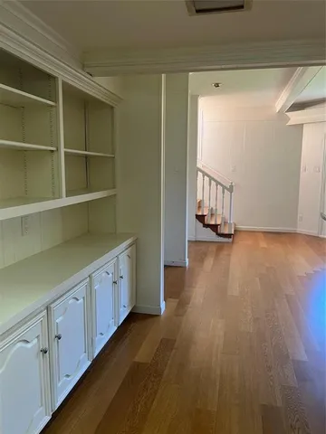 a hallway with cabinets