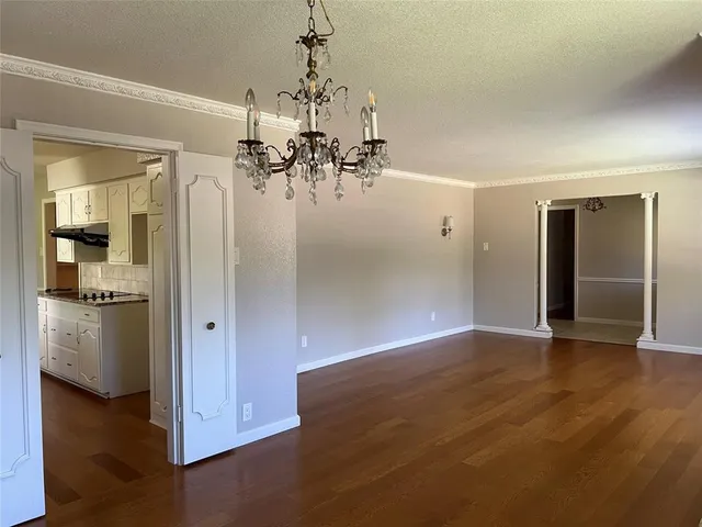 a view of a livingroom with a kitchen