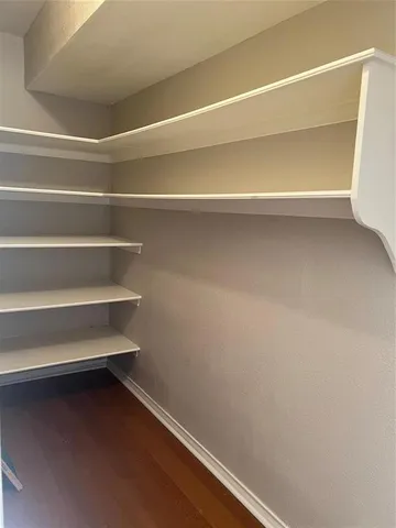 a view of a room that has a window in it