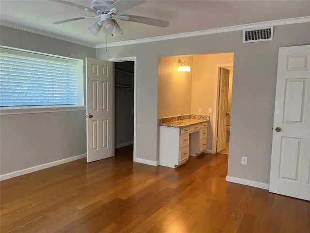 a bathroom with a granite countertop sink and shower