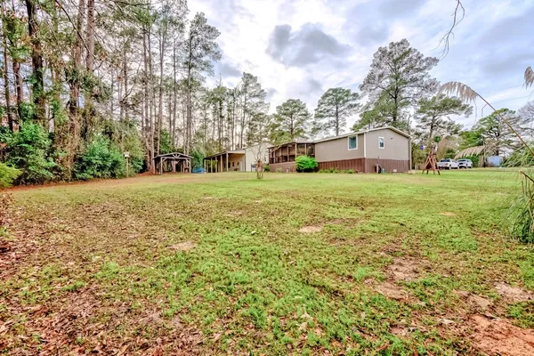 a view of a big yard with a house