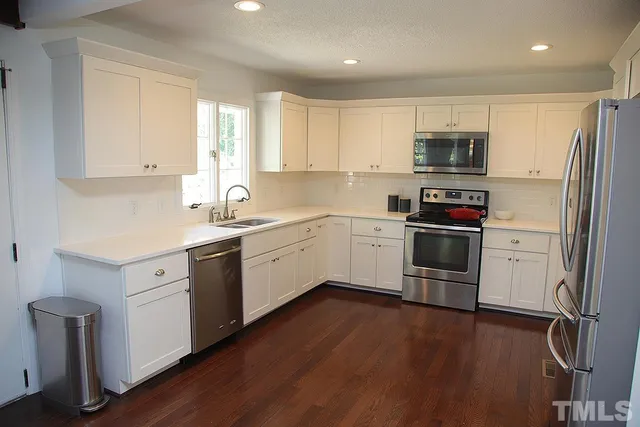 a kitchen with a sink and a window