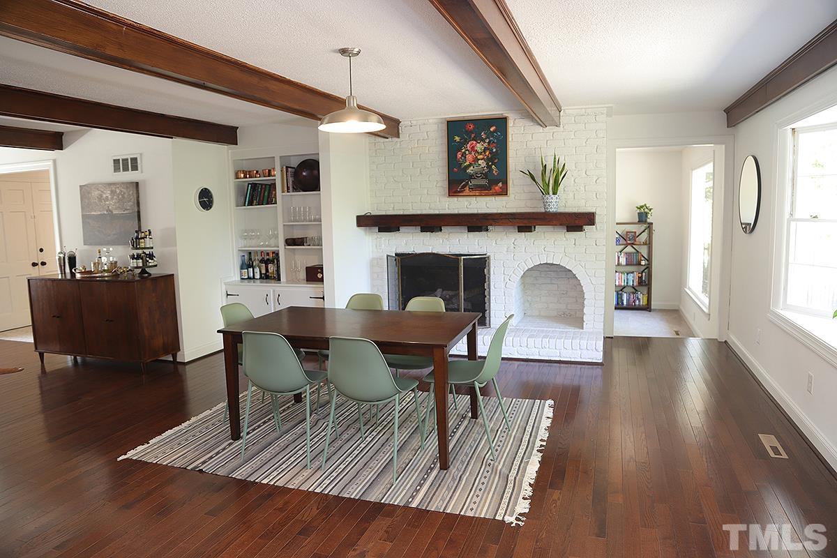 3712 Pleasant Valley Road Raleigh, NC 27613 - Photo 13 of 32 a living room with furniture and a fireplace