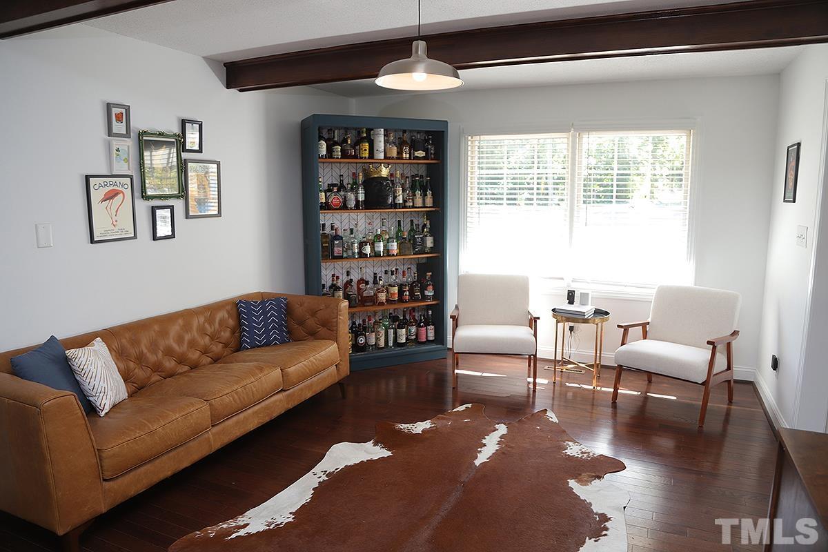 3712 Pleasant Valley Road Raleigh, NC 27613 - Photo 17 of 32 a living room with furniture and a large window