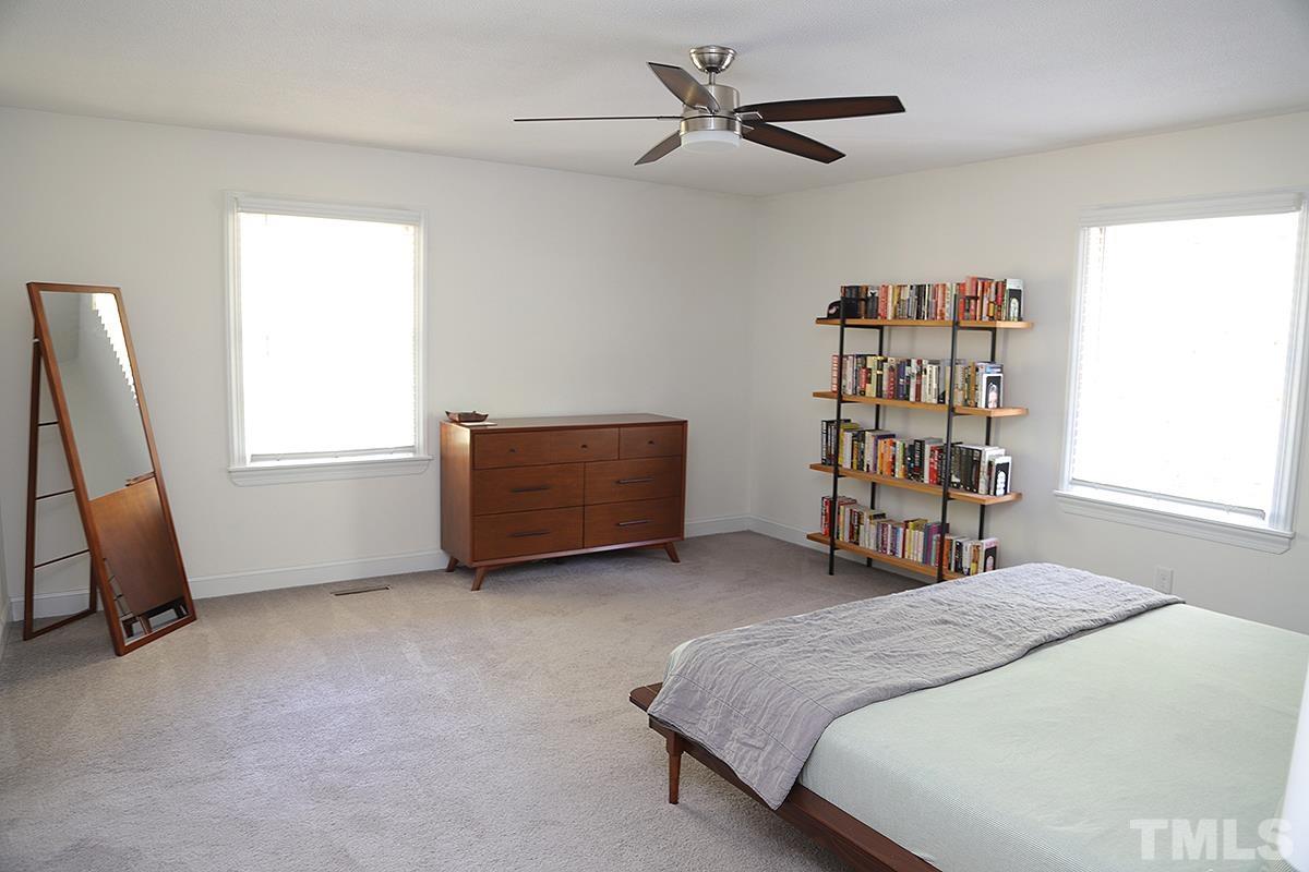 3712 Pleasant Valley Road Raleigh, NC 27613 - Photo 20 of 32 a bed room with a bed and a window