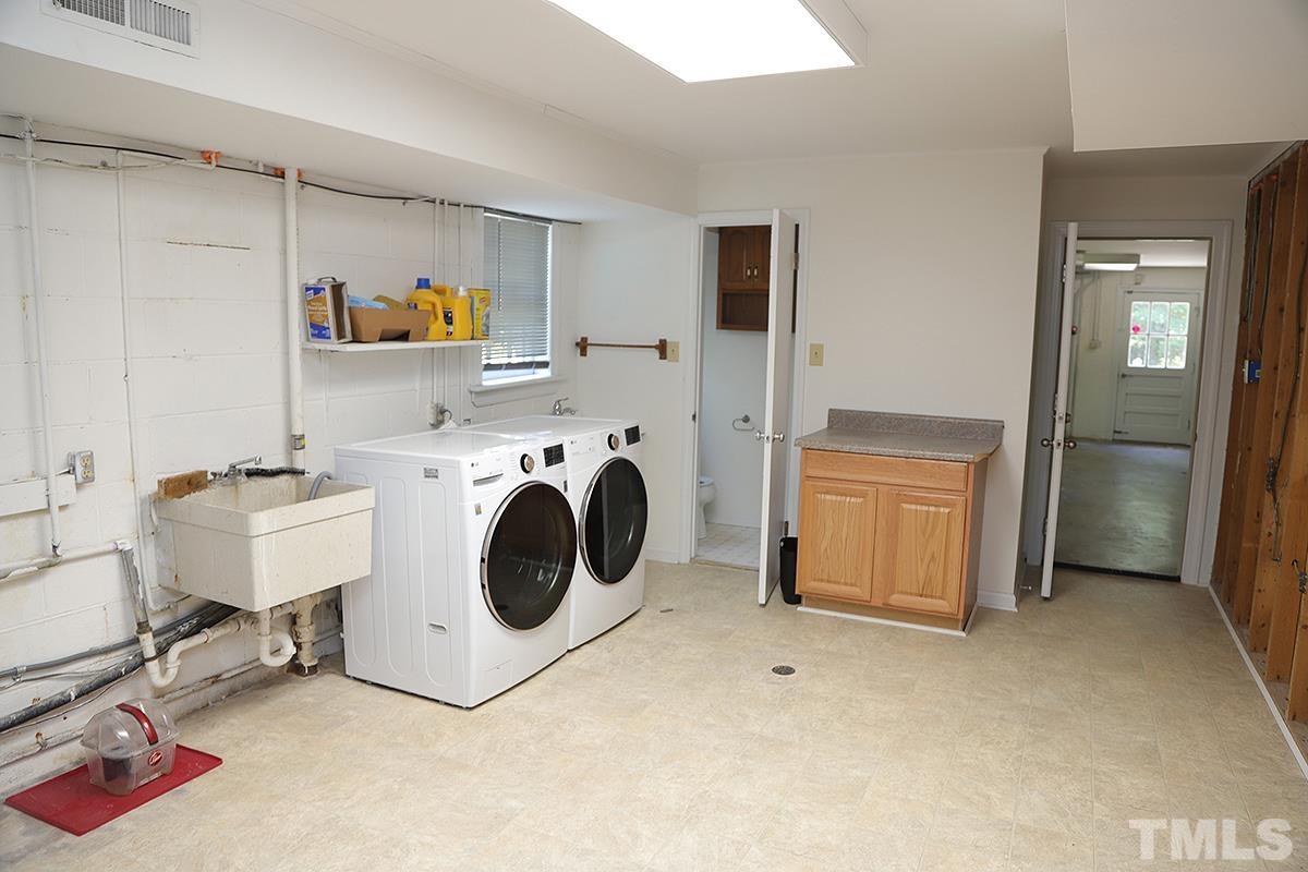 3712 Pleasant Valley Road Raleigh, NC 27613 - Photo 26 of 32 a utility room with dryer and washer