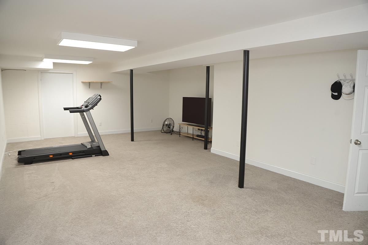 3712 Pleasant Valley Road Raleigh, NC 27613 - Photo 29 of 32 a view of a room with gym equipment