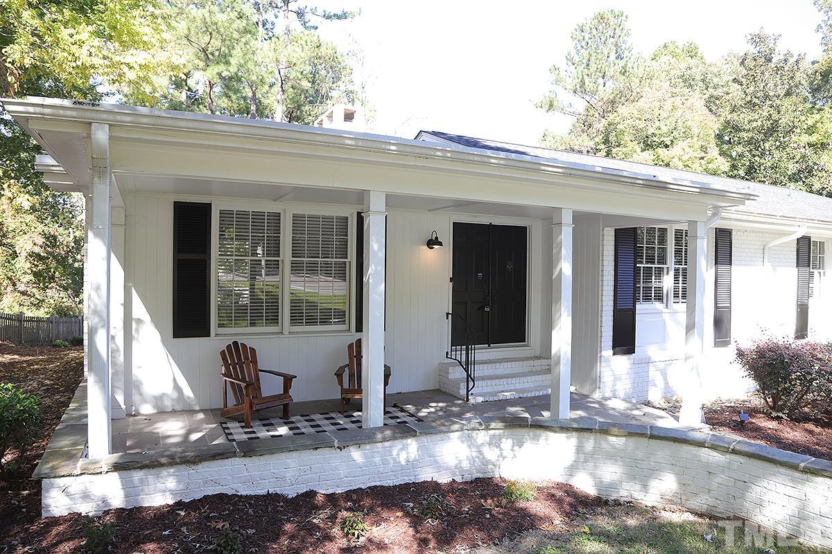 3712 Pleasant Valley Road Raleigh, NC 27613 - Photo 3 of 32 a front view of a house with garden