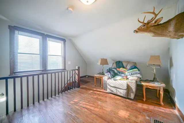 a bedroom with furniture and a window