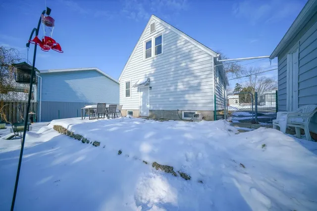 a spacious bathroom with a granite countertop sink and cabinets