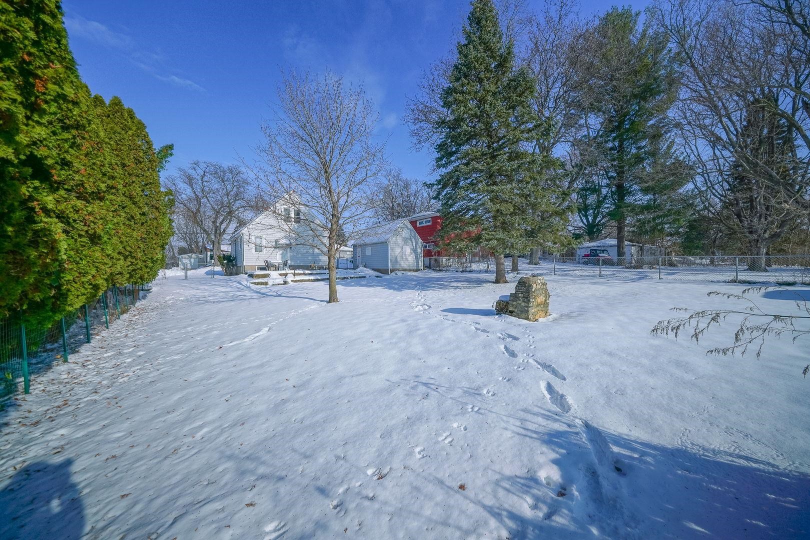 409 West Lincoln Street Mount Morris, IL 61054 - Photo 21 of 28 a view of the roadside with trees