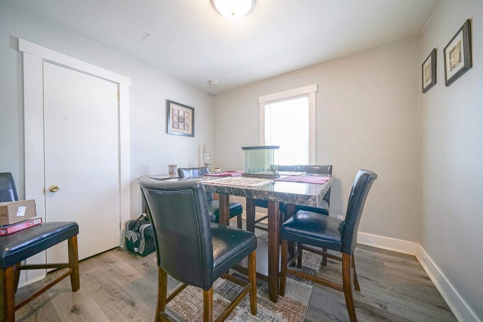409 West Lincoln Street Mount Morris, IL 61054 - Photo 4 of 28 a view of a dining room with furniture and wooden floor