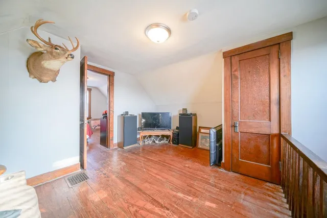 a room with furniture and a wooden floor