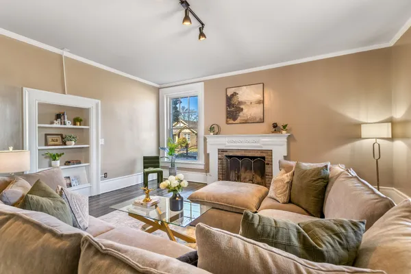 a living room with furniture and a rug