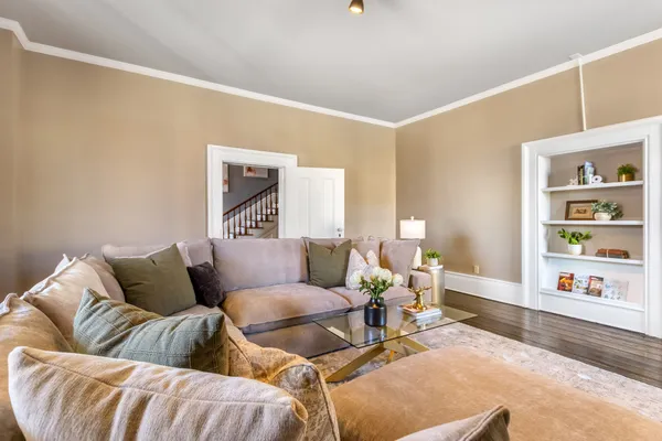 a living room with furniture and a fireplace