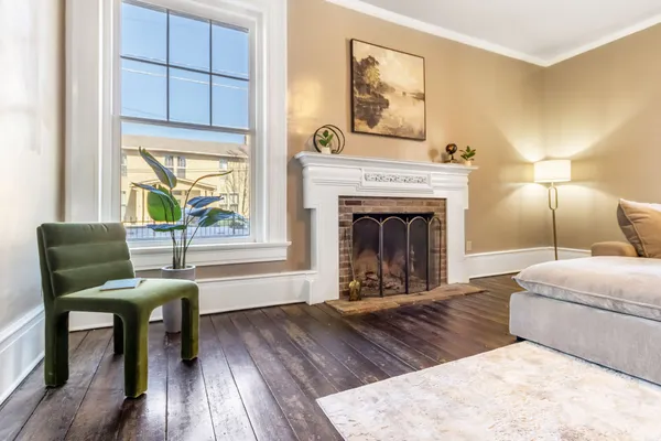 a living room with furniture and a fireplace