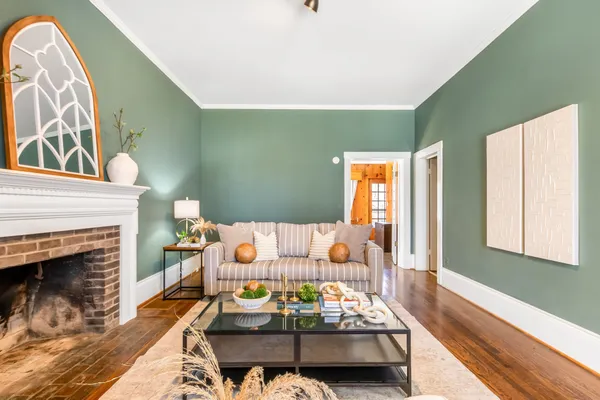 a living room with furniture and a fireplace