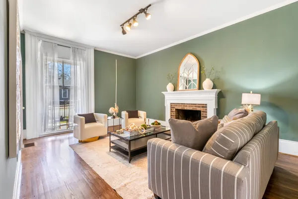 a living room with furniture and a fireplace