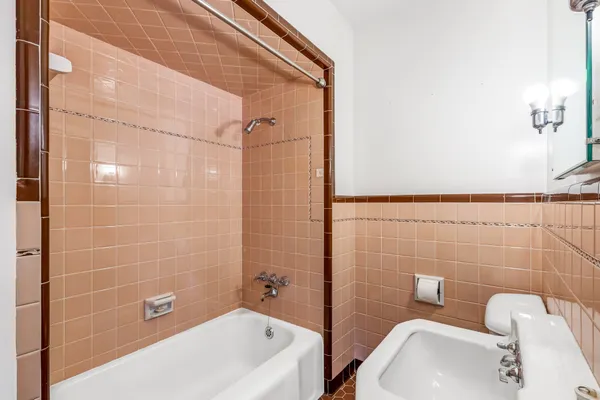 a view of a dining room with furniture and a chandelier