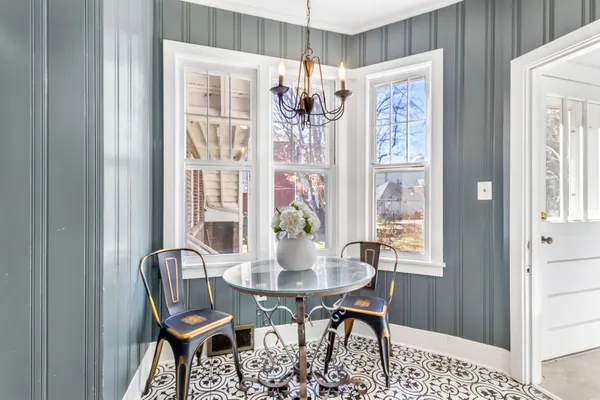 a kitchen with stainless steel appliances granite countertop white cabinets sink and a stove