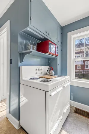 a bedroom with a bed a table and chair