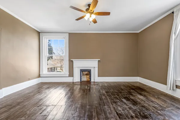 a bathroom with a sink a toilet and shower curtain