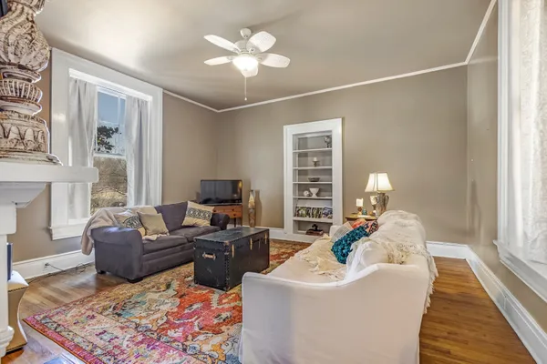 a view of a livingroom with furniture and a fireplace