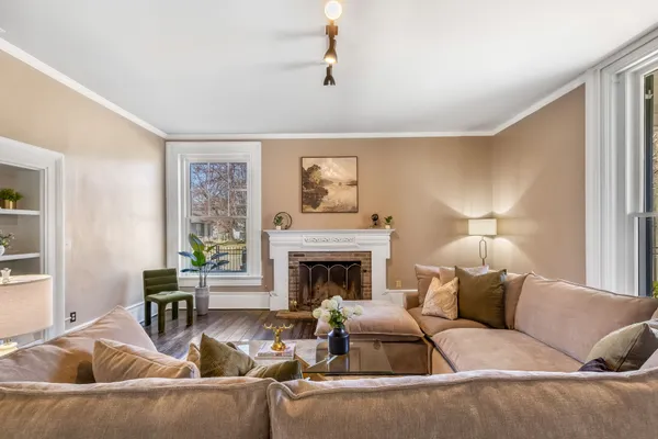 a living room with furniture and a fireplace