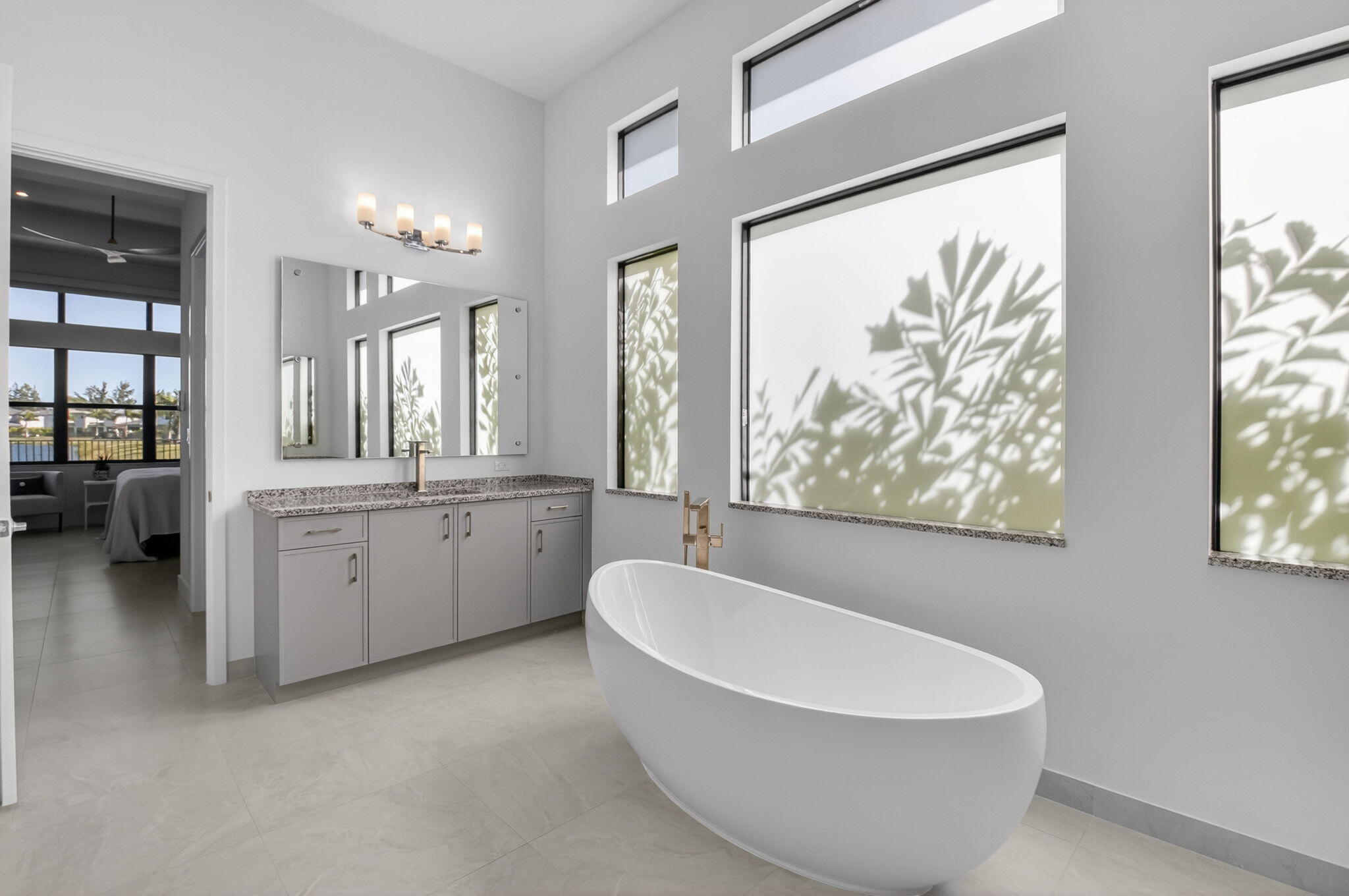 20370 Whistling Straits Way Boca Raton, FL 33434 - Photo 16 of 41 a white bath tub sitting next to a white sink