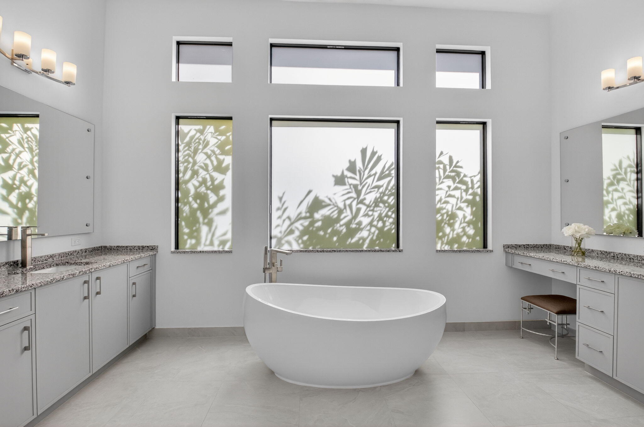 20370 Whistling Straits Way Boca Raton, FL 33434 - Photo 17 of 41 a spacious bathroom with a tub sink and mirror