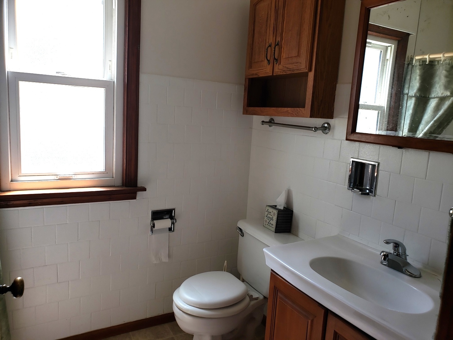 Undisclosed Address Kankakee, IL 60901 - Photo 18 of 35 a bathroom with a toilet sink and mirror