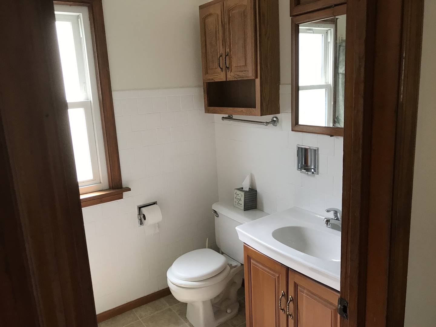 Undisclosed Address Kankakee, IL 60901 - Photo 19 of 35 a bathroom with a sink toilet and window